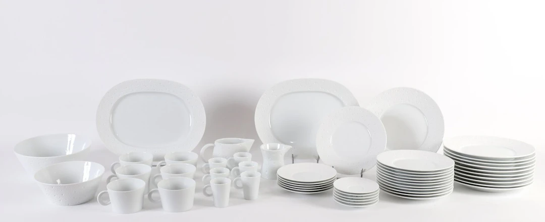 BERNARDAUD “ÉCUME” 53-PIECE PORCELAIN SET. - Lot 200