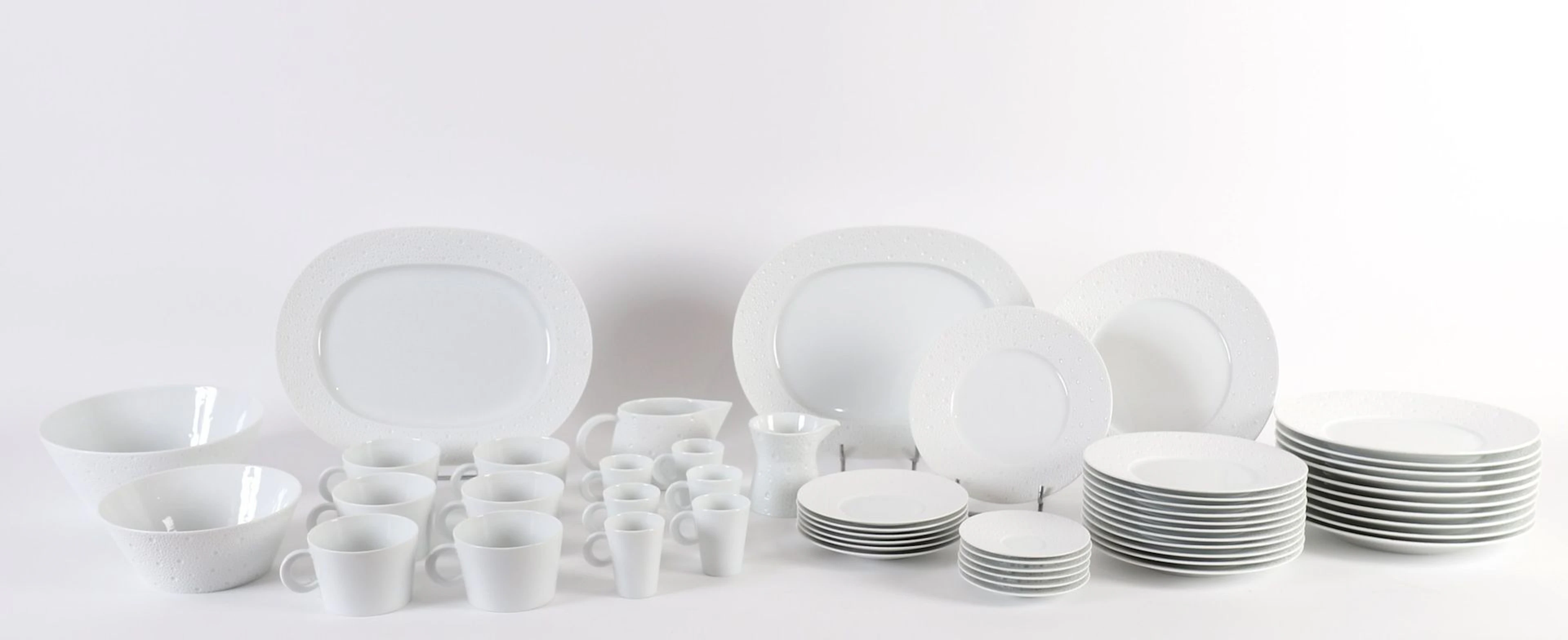 BERNARDAUD “ÉCUME” 53-PIECE PORCELAIN SET. - Lot 200