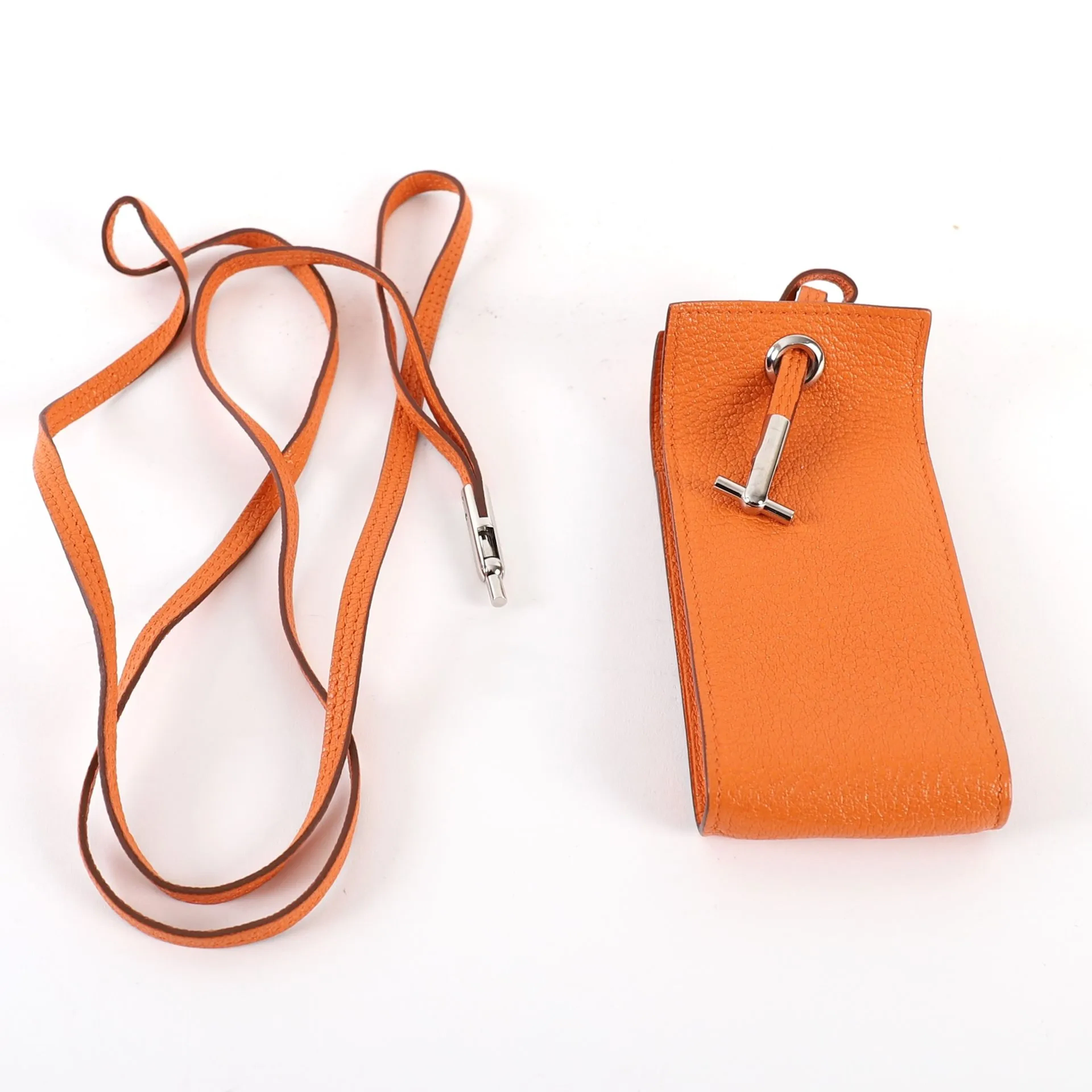 HERMÈS "PLANET" ORANGE LEATHER CASE - Lot 126