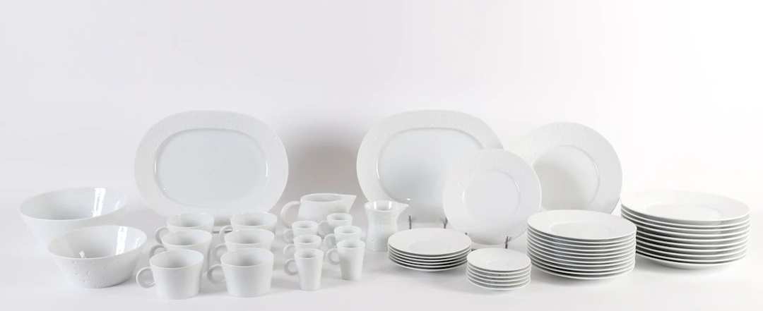 BERNARDAUD “ÉCUME” 53-PIECE PORCELAIN SET. - Lot 200