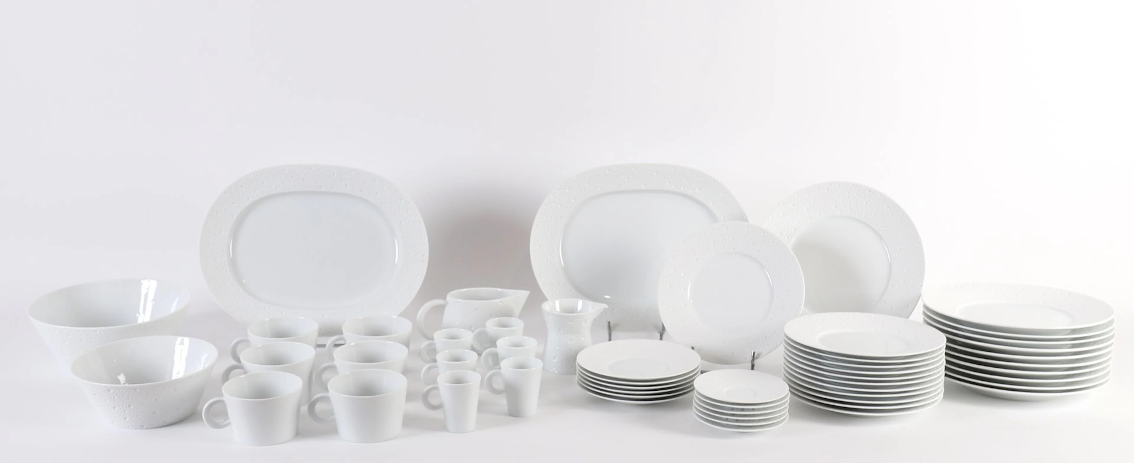 BERNARDAUD “ÉCUME” 53-PIECE PORCELAIN SET. - Lot 200