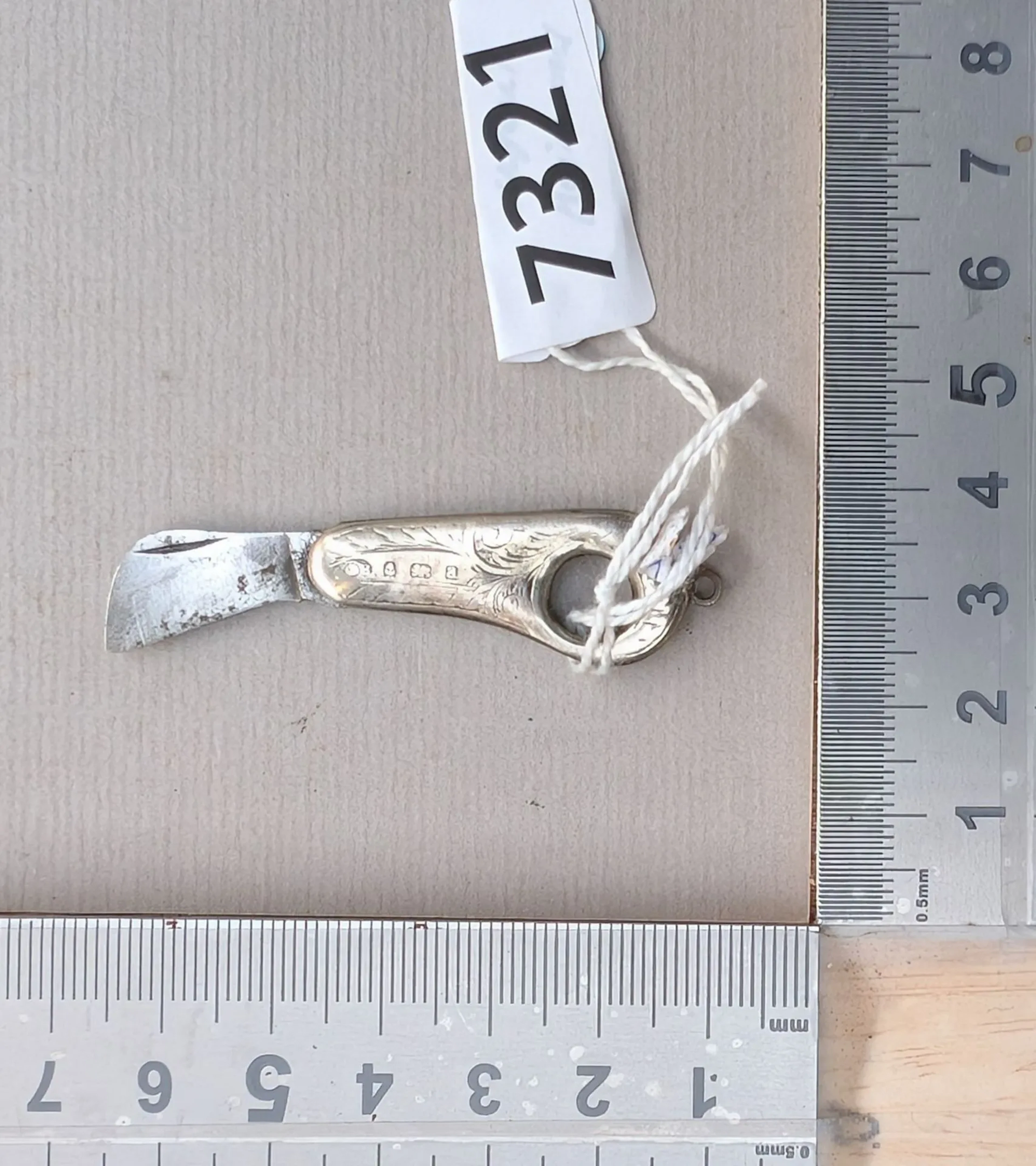 1 mini silver embossed knife—see photos for dimensions and condition
