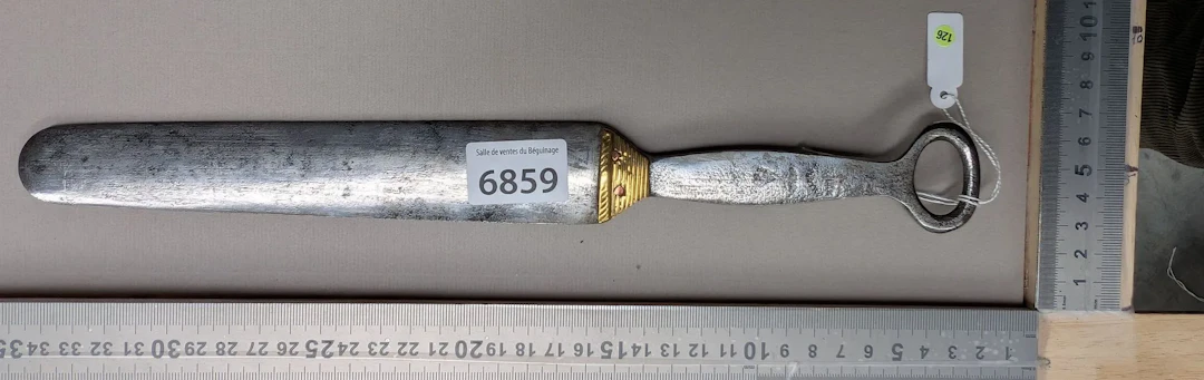 Antique butcher's sharpening knife with steel handle, 20th century—see