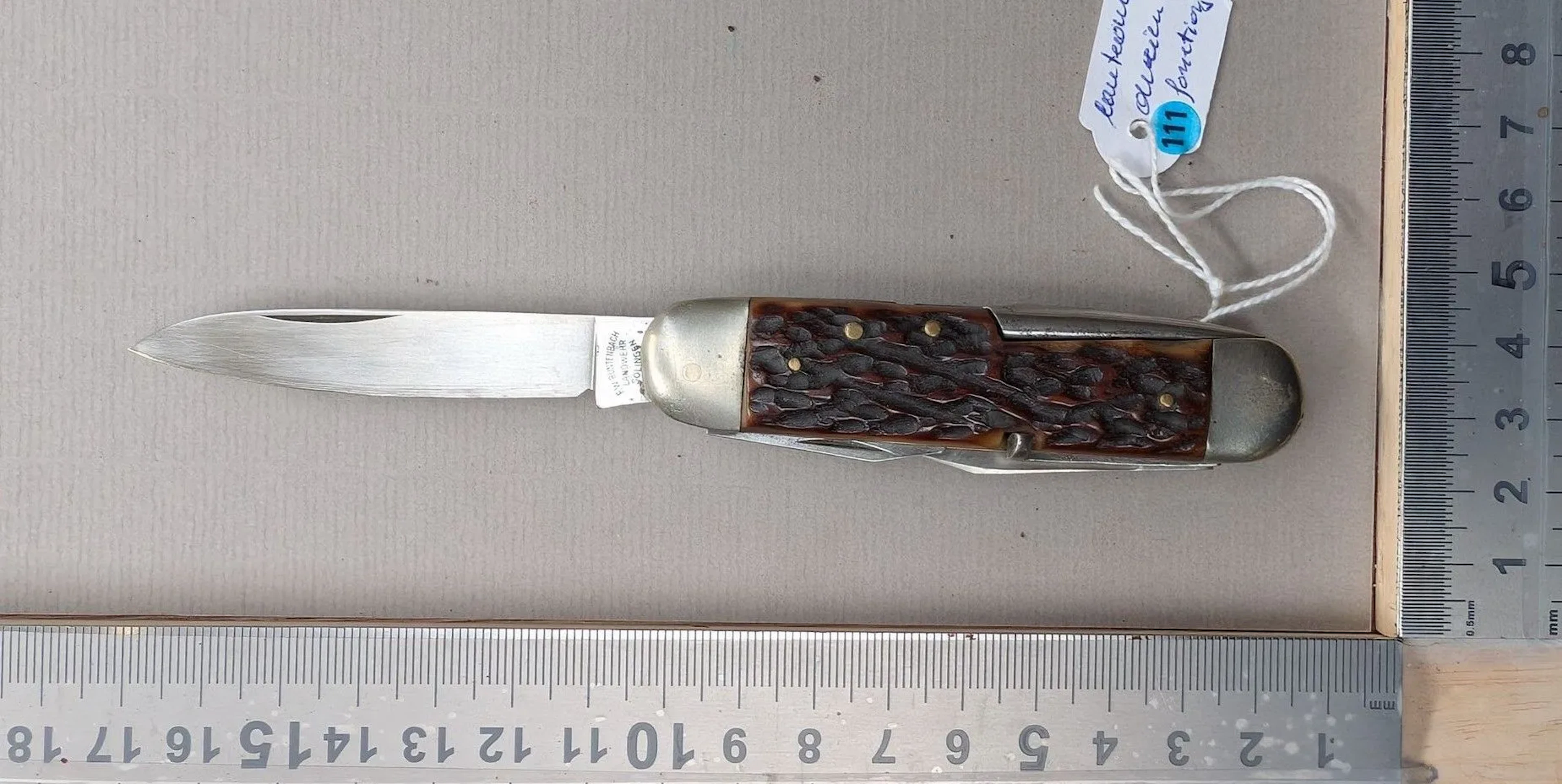 Vintage SOLINGEN multifunction knife with a horn handle—see photos
