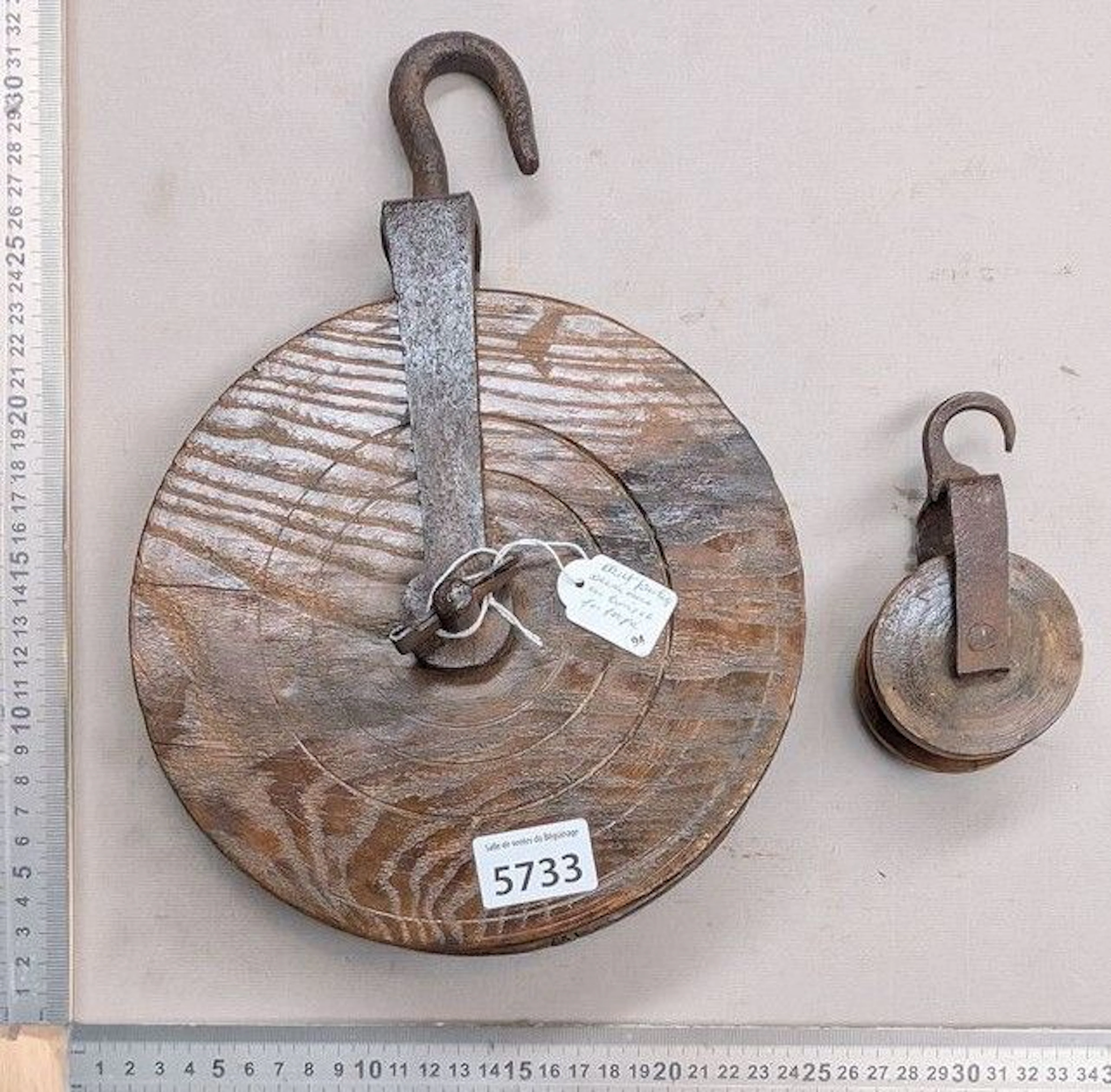 2 wooden and wrought-iron pulleys—see photos for dimensions and condition