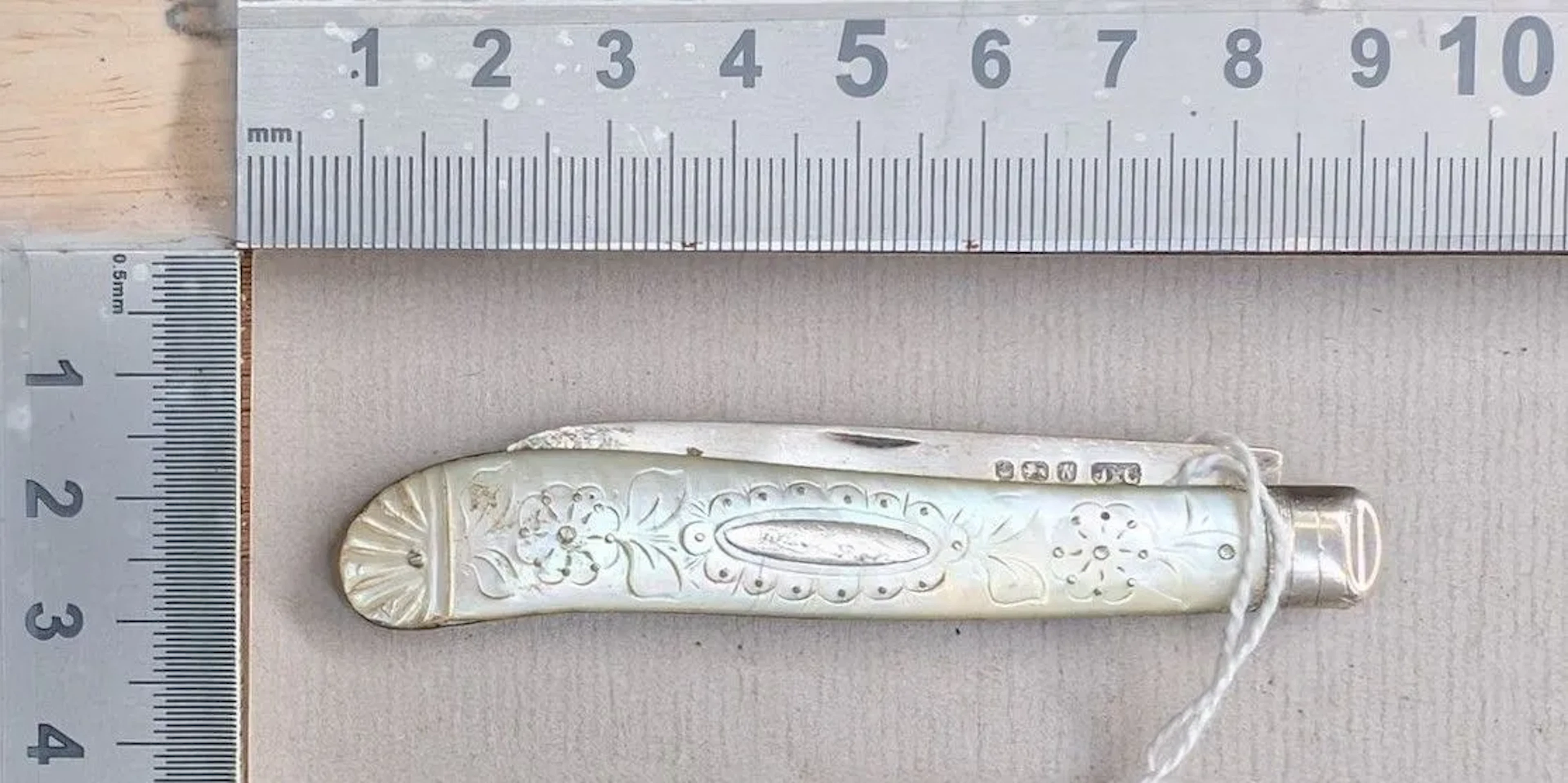 1 antique fruit knife with a silver blade and mother-of-pearl handle—see
