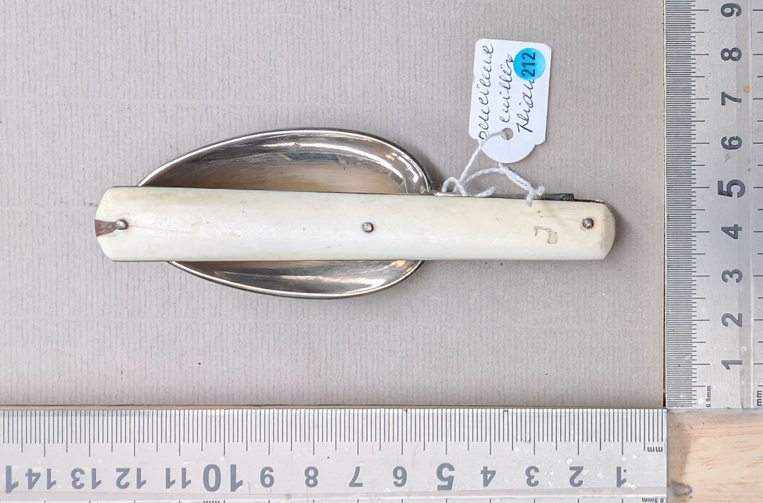 Antique folding spoon—see photos for dimensions and condition
