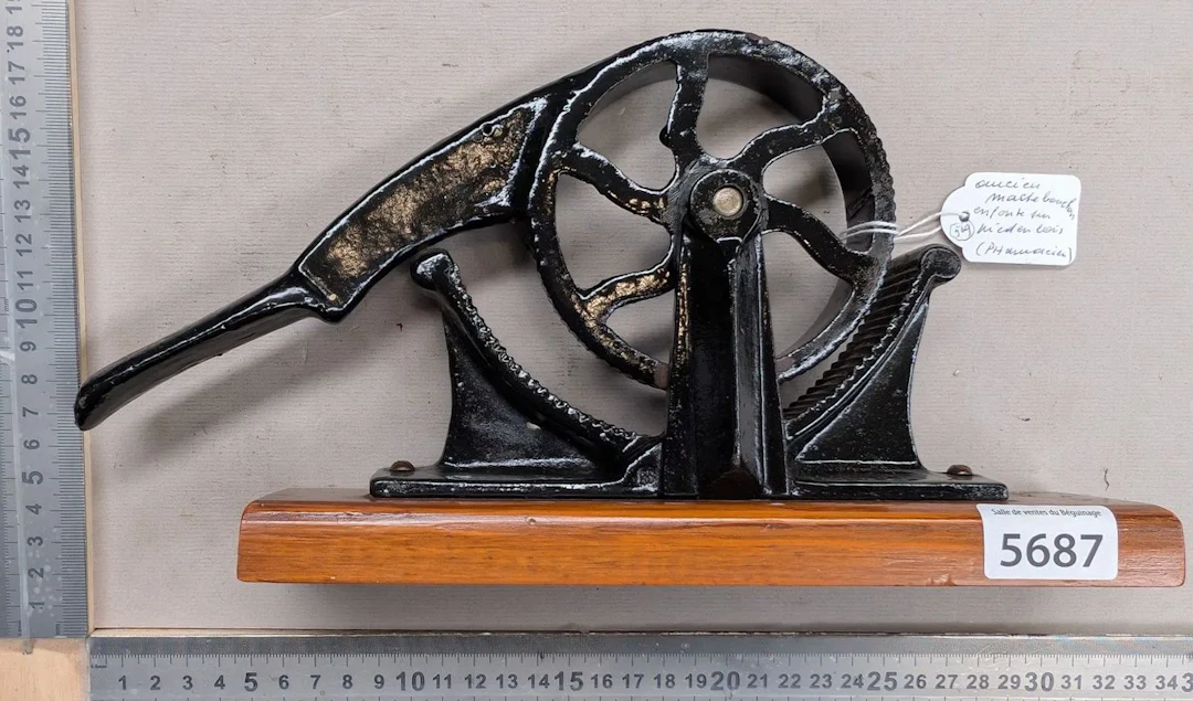 Antique pharmacist's cork-crusher on a wooden base—see photos for
