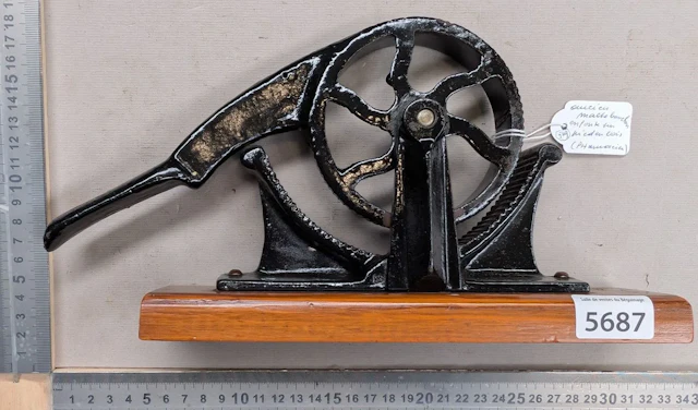 Antique pharmacist's cork-crusher on a wooden base—see photos for