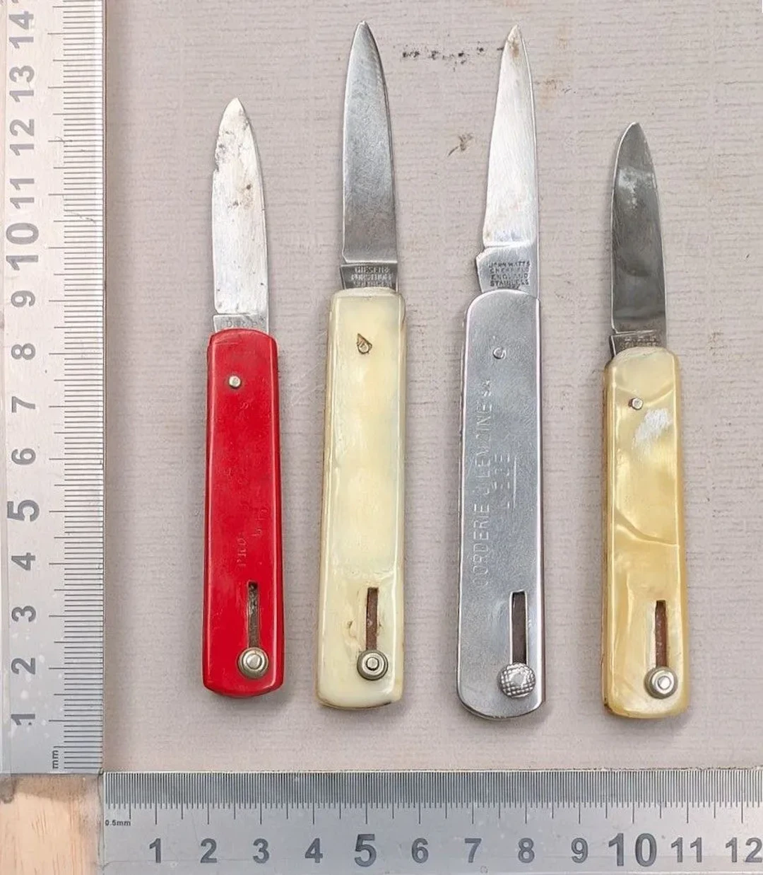 Set of 4 antique knives—see photos for dimensions and condition
