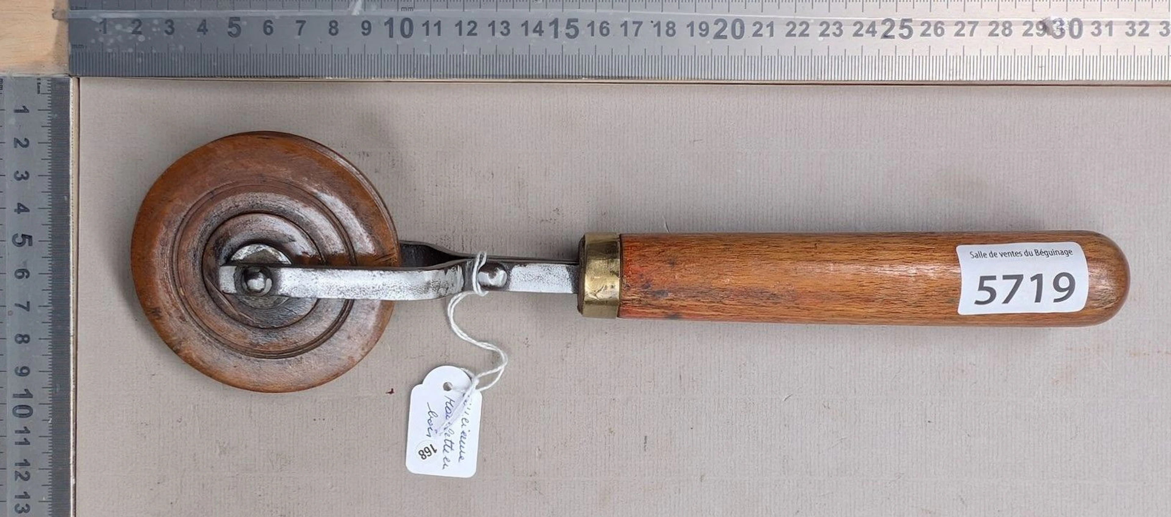 Vintage wheel with wooden handle—see photos for dimensions and condition