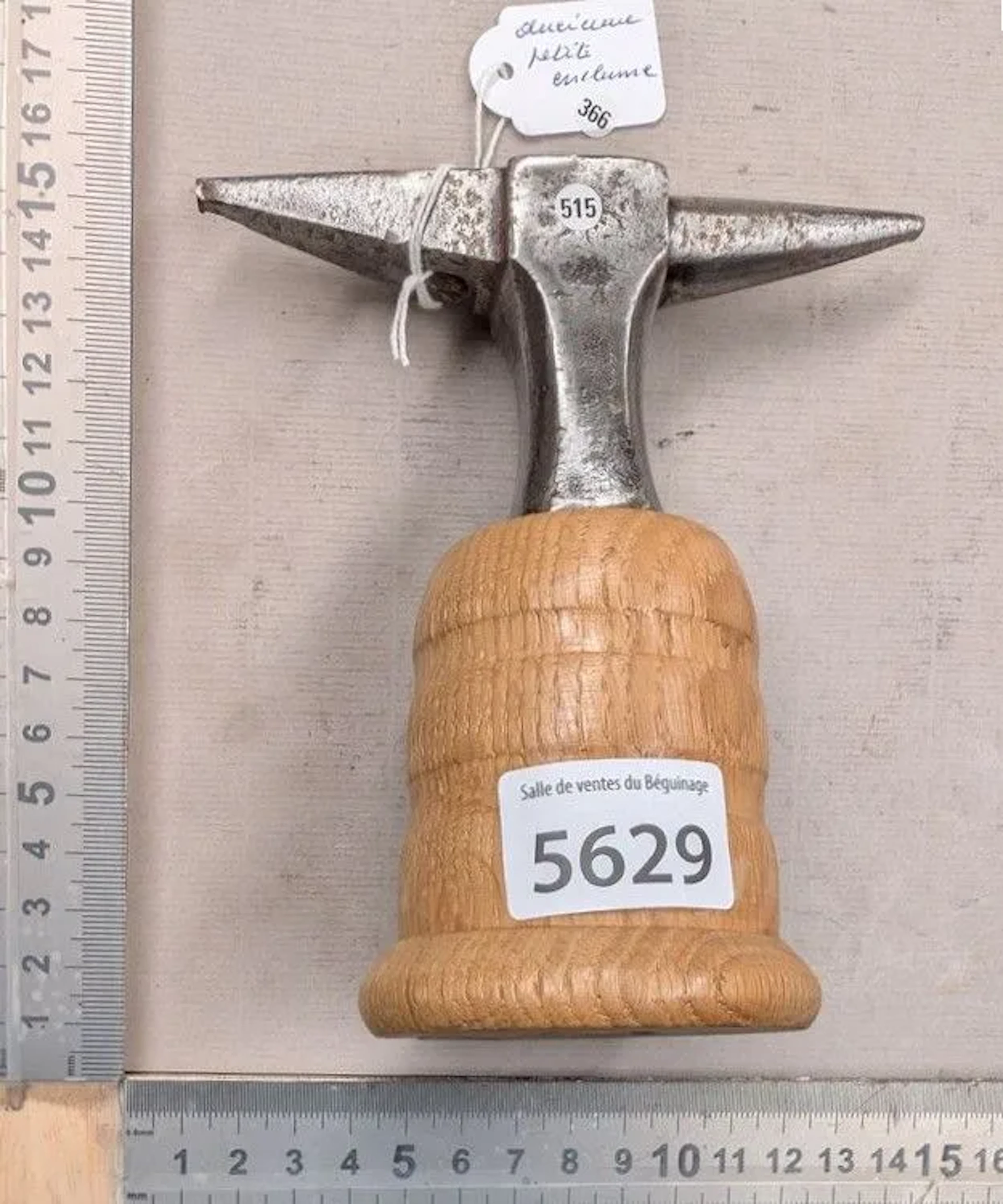 Antique small anvil on a wooden base—see photos for dimensions and condition