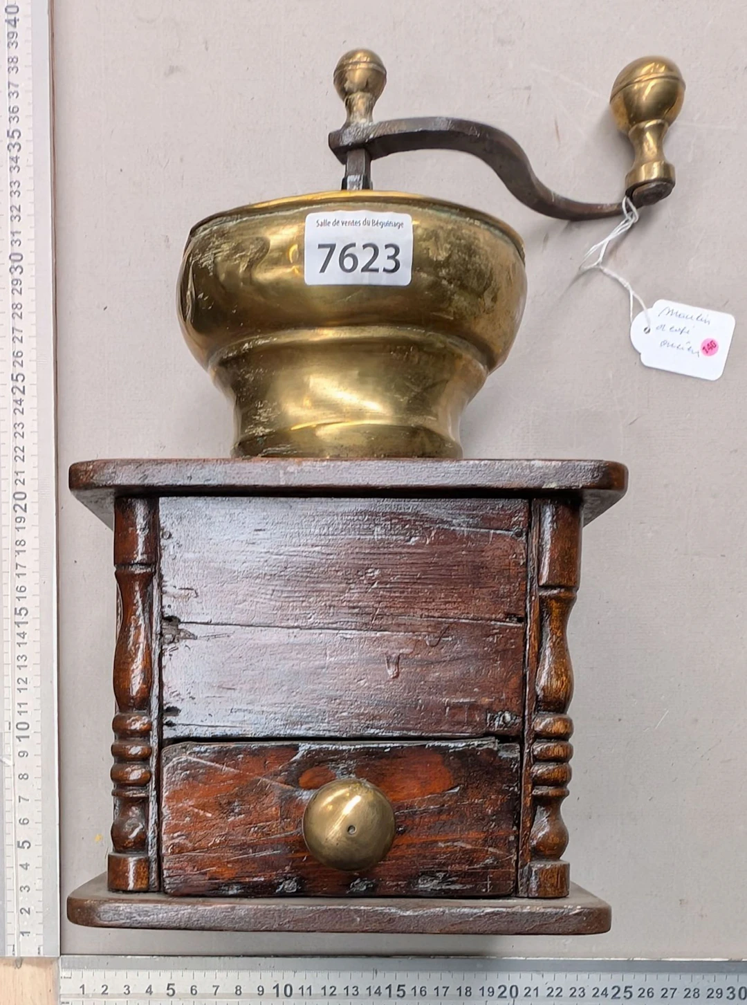 Small cast-iron skillet with three legs and a wooden handle—see photos