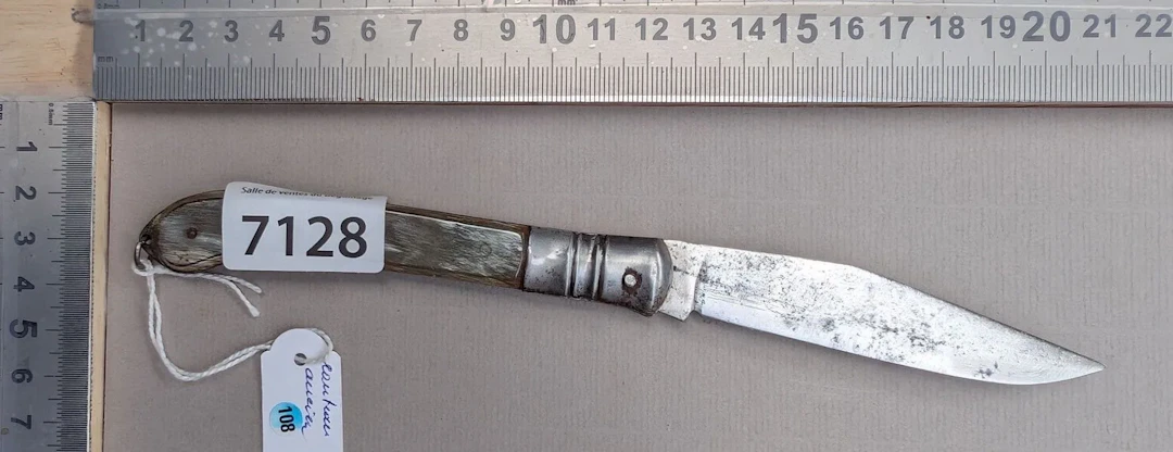 Antique knife with a horn handle—see photos for dimensions and condition