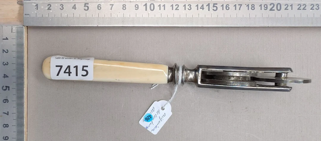 1 antique knife sharpener with a mother-of-pearl handle—see photos