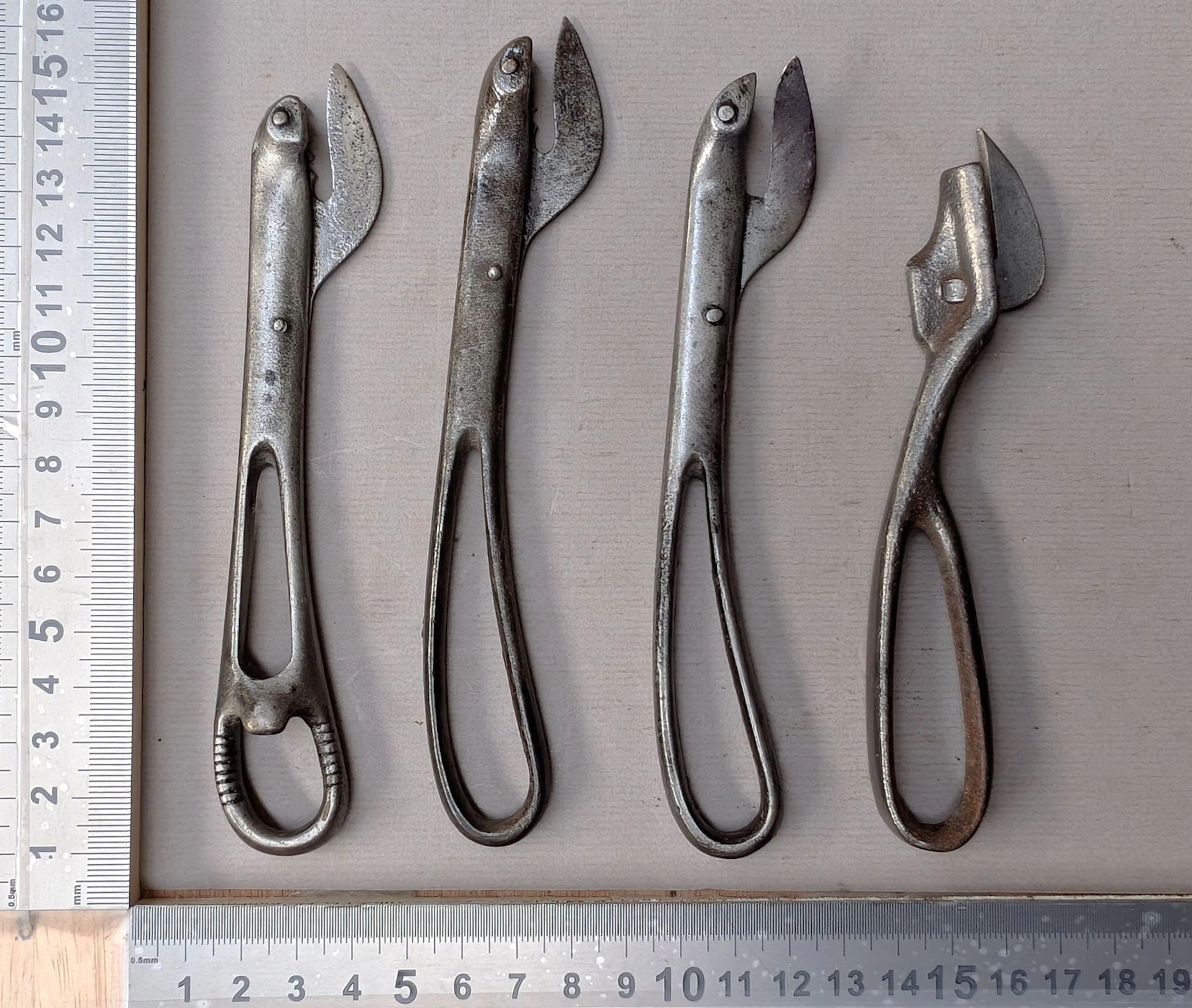 4 antique can openers—see photos for dimensions and condition