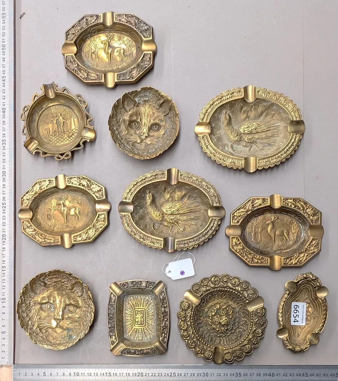 10 bronze ashtrays with different designs—see photos for dimensions