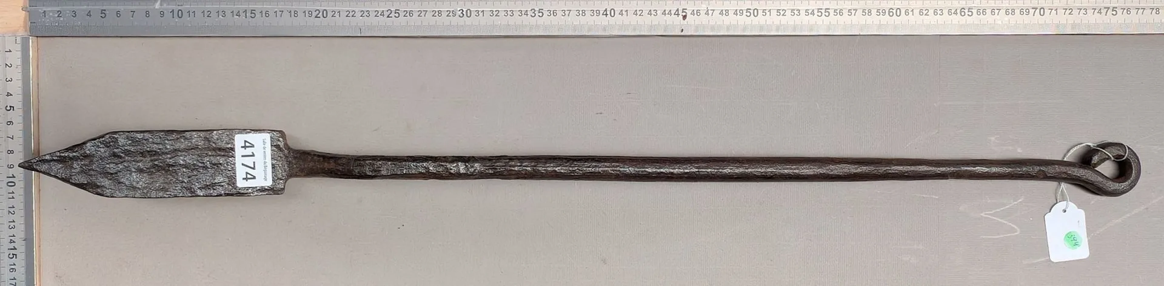 Rare wrought-iron floor iron—see photos for dimensions and condition