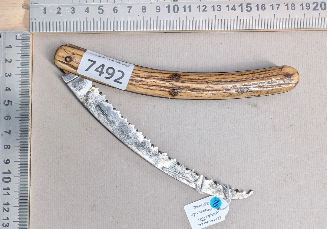 1 small antique folding saw with a horn handle—see photos for dimensions