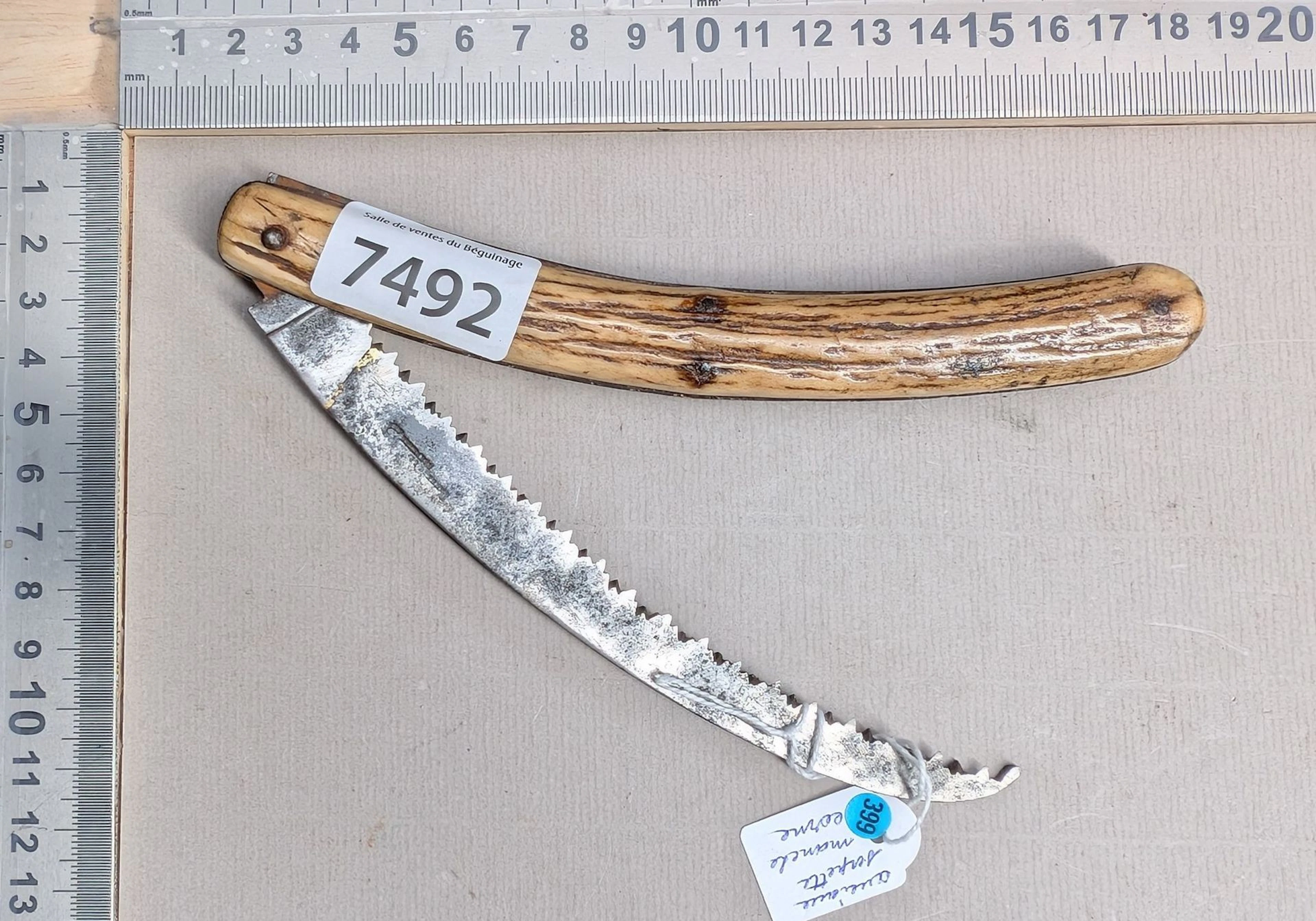 1 small antique folding saw with a horn handle—see photos for dimensions