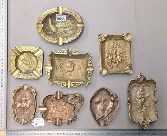 7 bronze ashtrays with different designs—see photos for dimensions