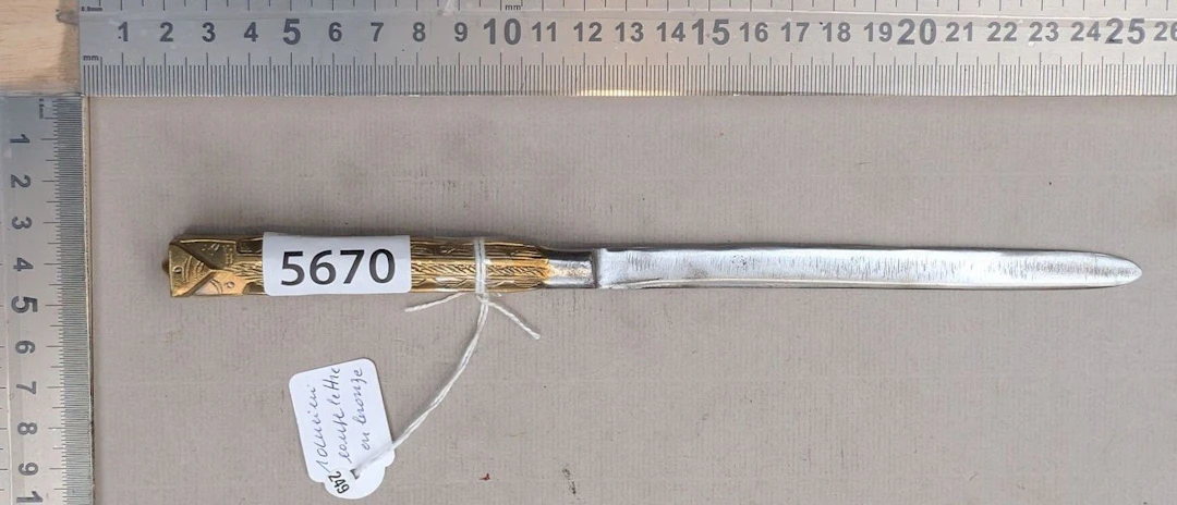 An antique bronze letter opener—see photos for dimensions and condition