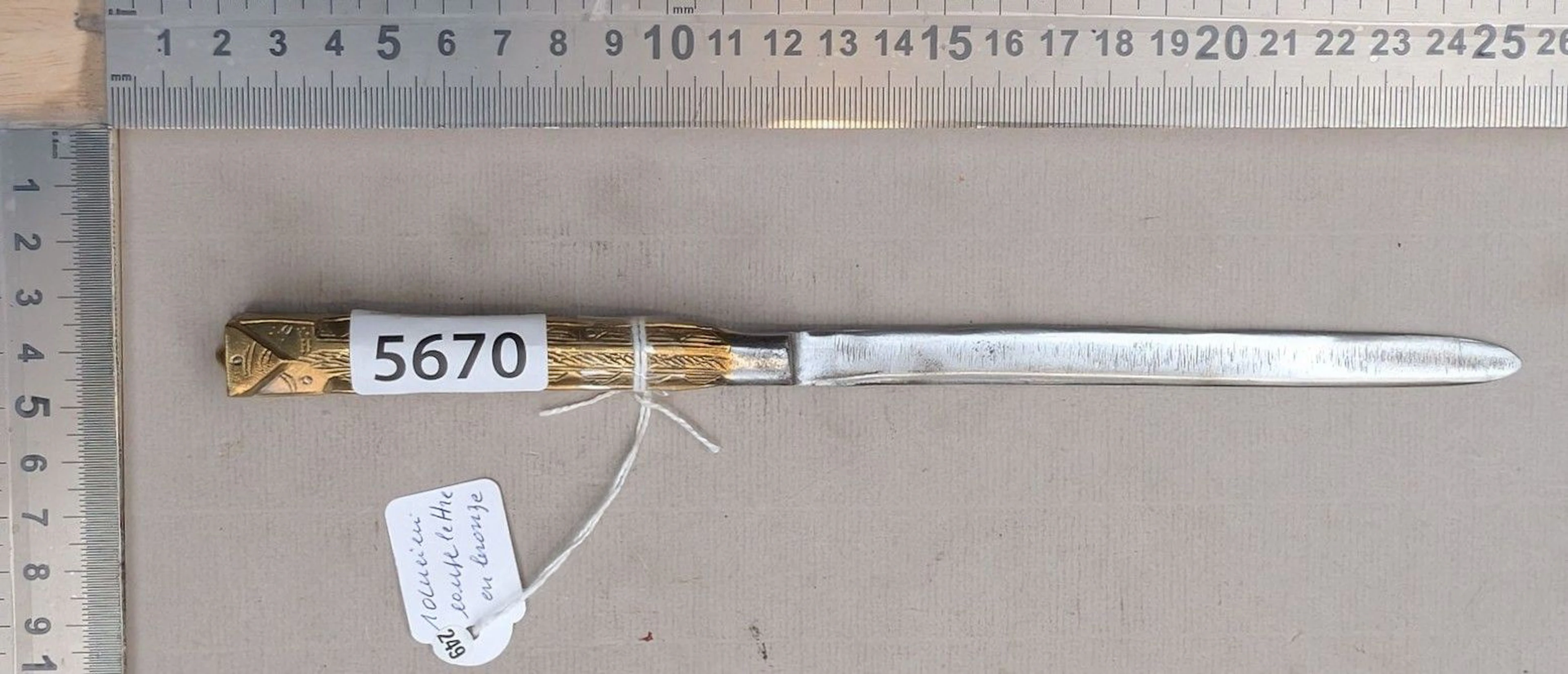 An antique bronze letter opener—see photos for dimensions and condition