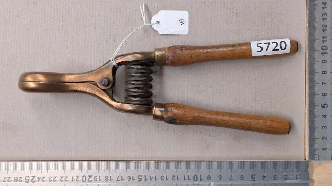 Antique bronze electrical clamp, wooden handle—see photos for dimensions