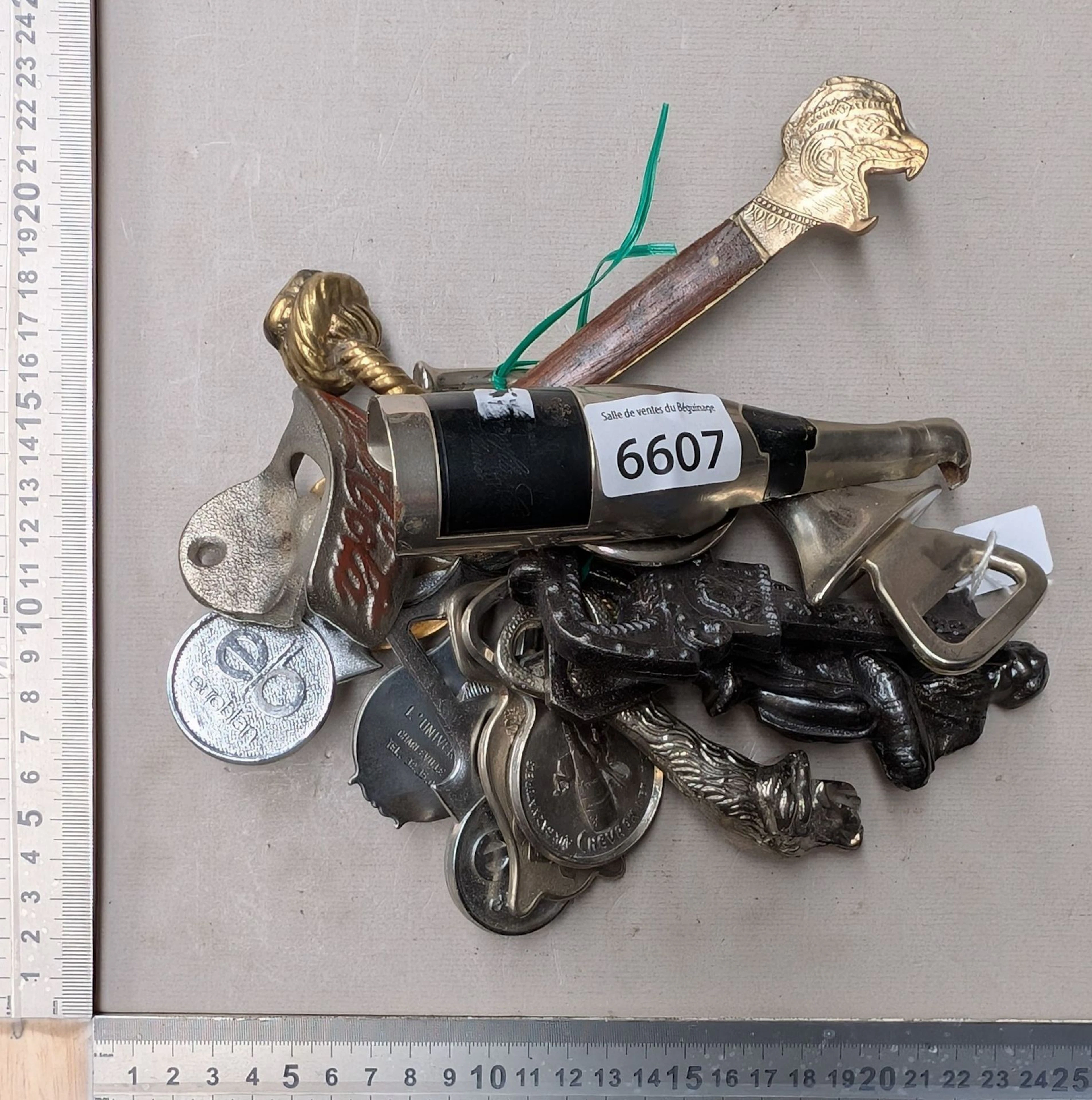 13 antique bottle openers—see photos for dimensions and condition