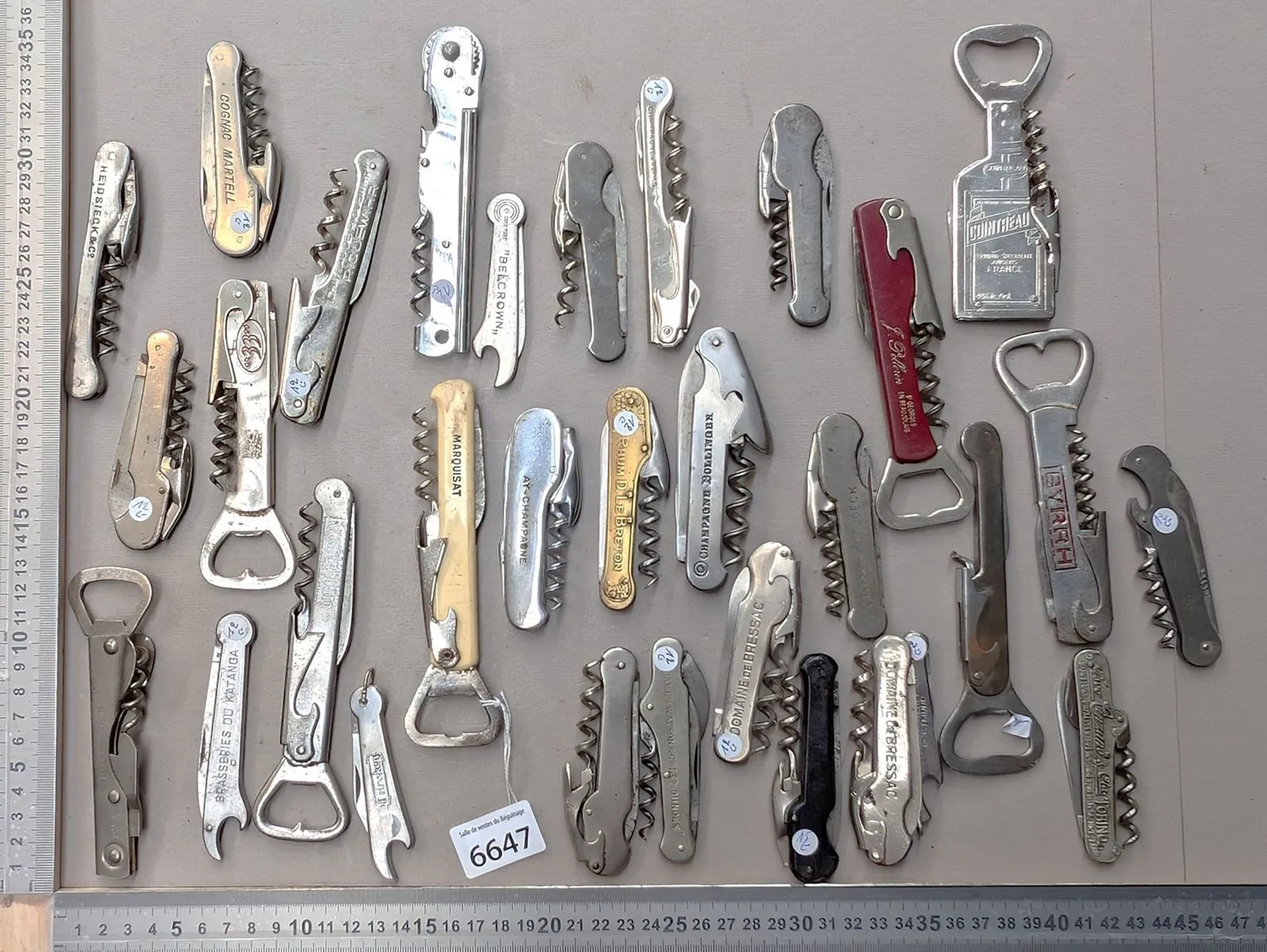 31 different bottle openers—see photos for dimensions and condition