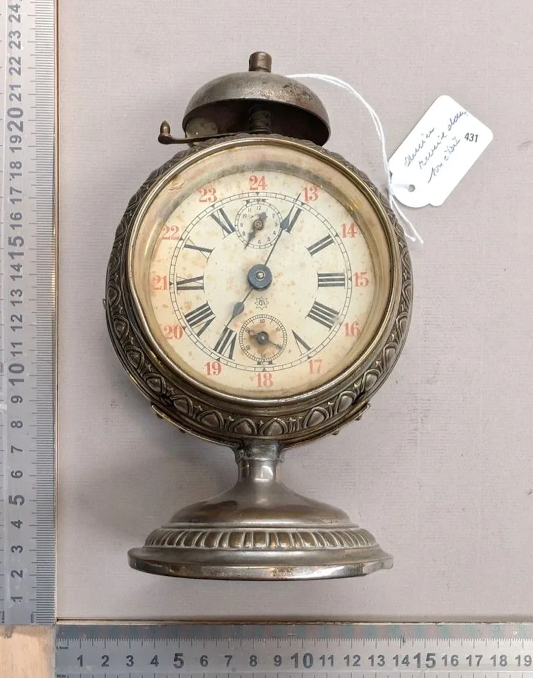 Vintage metal alarm clock in its original condition—see photos for