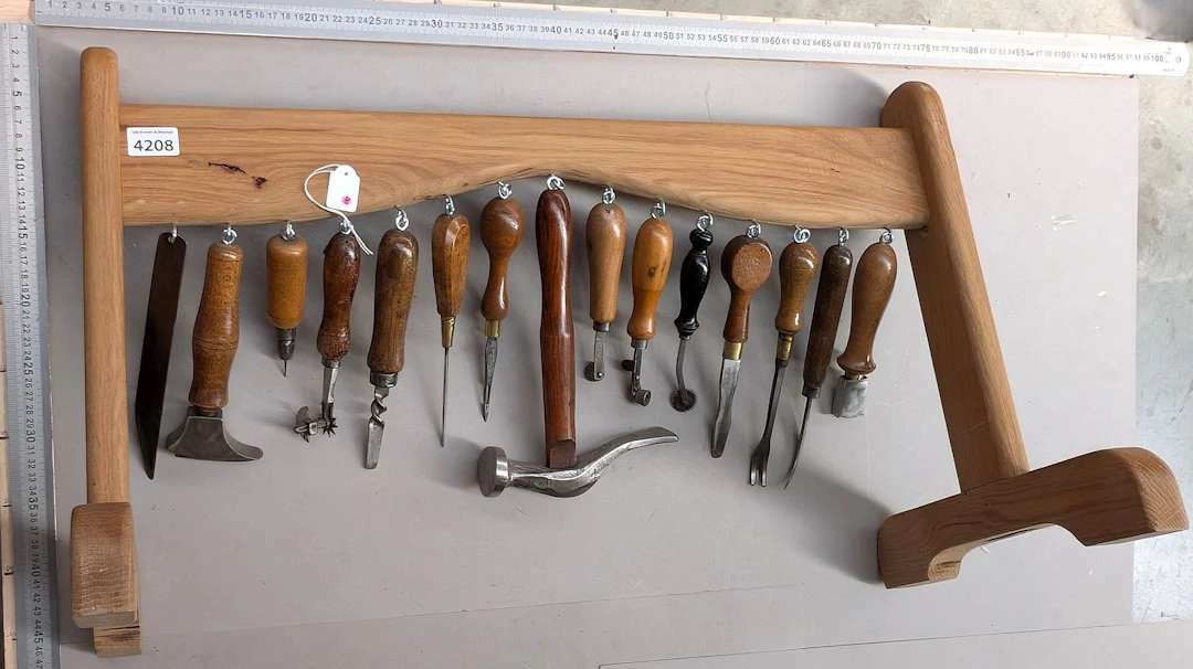 15 shoemaker's and saddler's tools on an oak base—see photos for dimensions