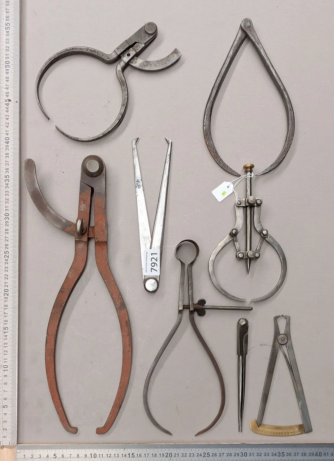 1 set of 8 different compasses—see photos for dimensions and condition