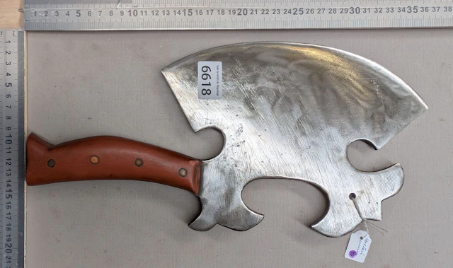 Antique cleaver with steel blade and wooden handle—see photos for