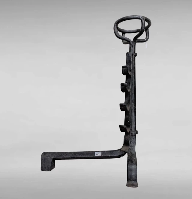 1 17th-century wrought-iron bowl-shaped coat rack with 4 hooks—see