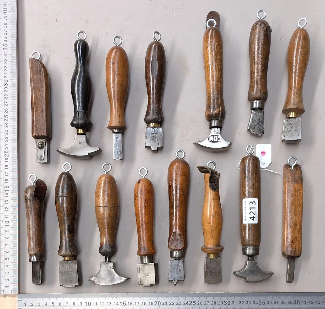 15 shoemaker's and saddler's tools on an oak base—see photos for dimensions