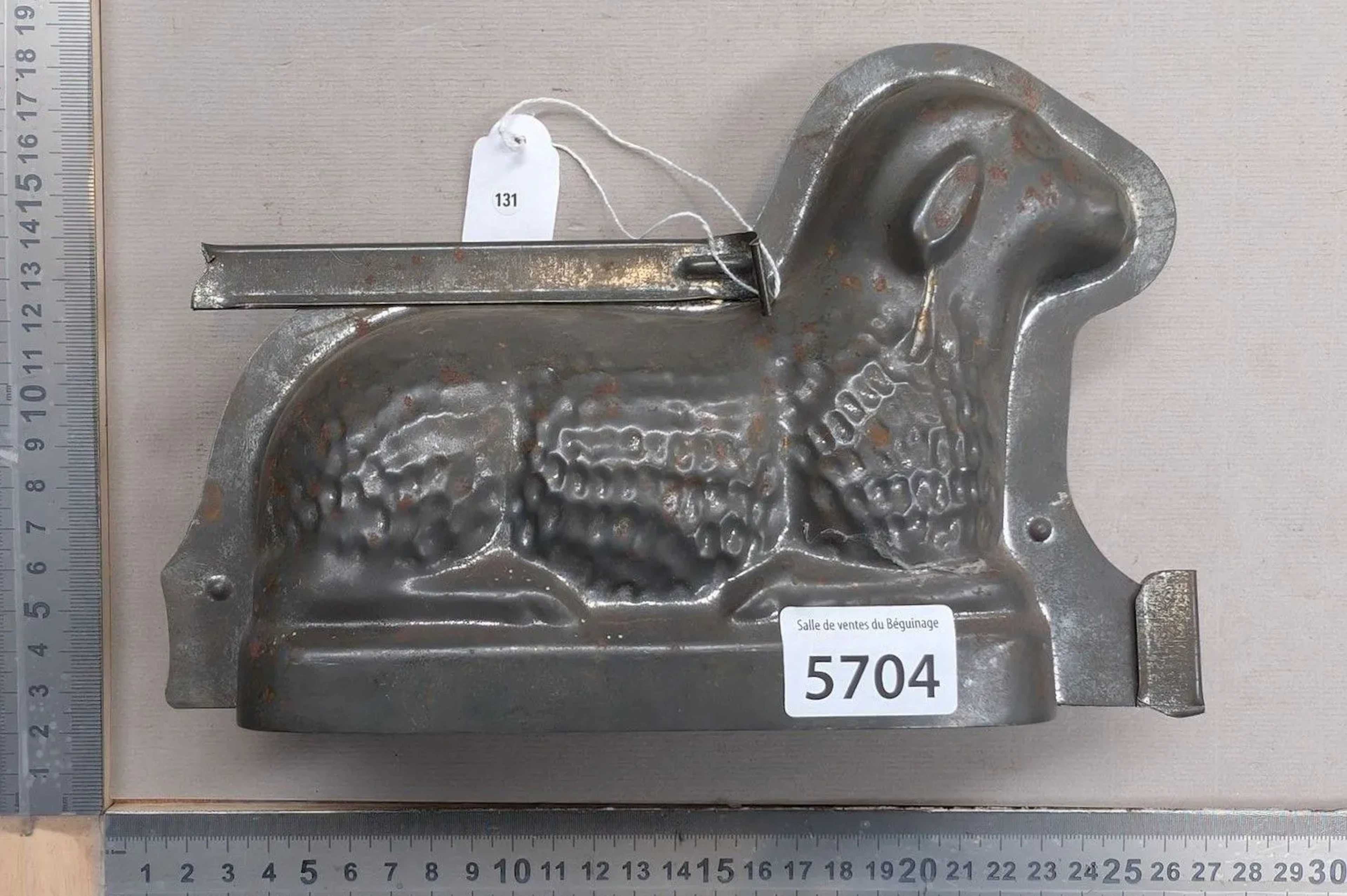 An antique metal lamb mold—see photos for dimensions and condition