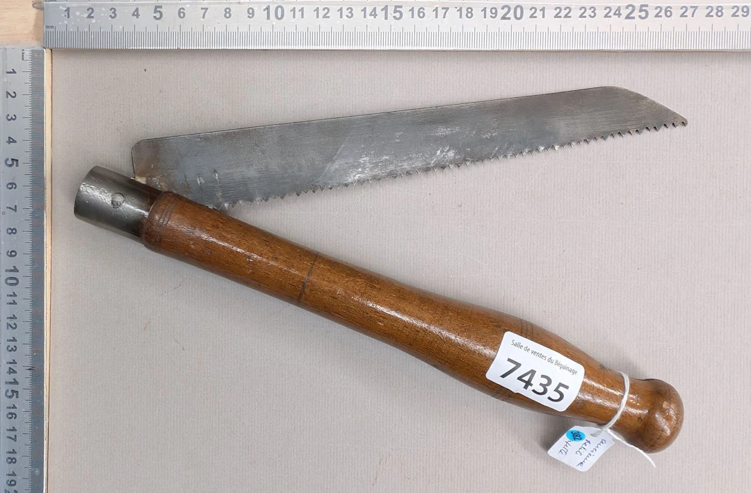 1 old small SOMBORN TREMFE folding saw with a wooden handle—see photos