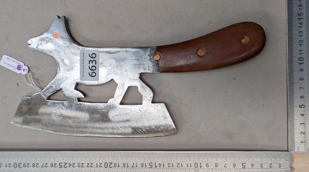 Antique cleaver with steel blade and wooden handle—see photos for