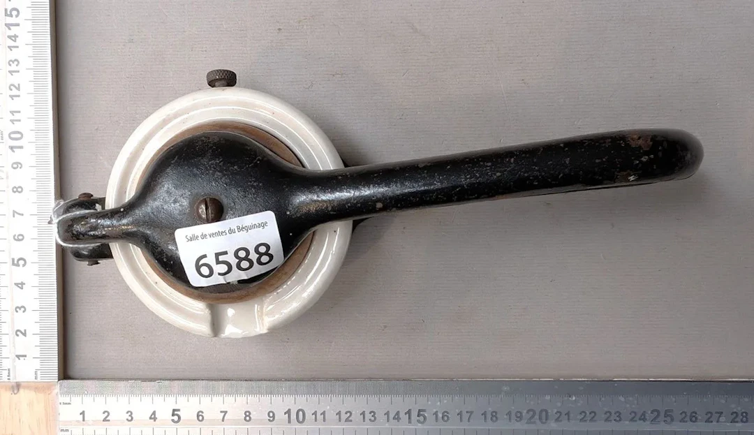 1 antique small fruit press made of cast iron and earthenware—see