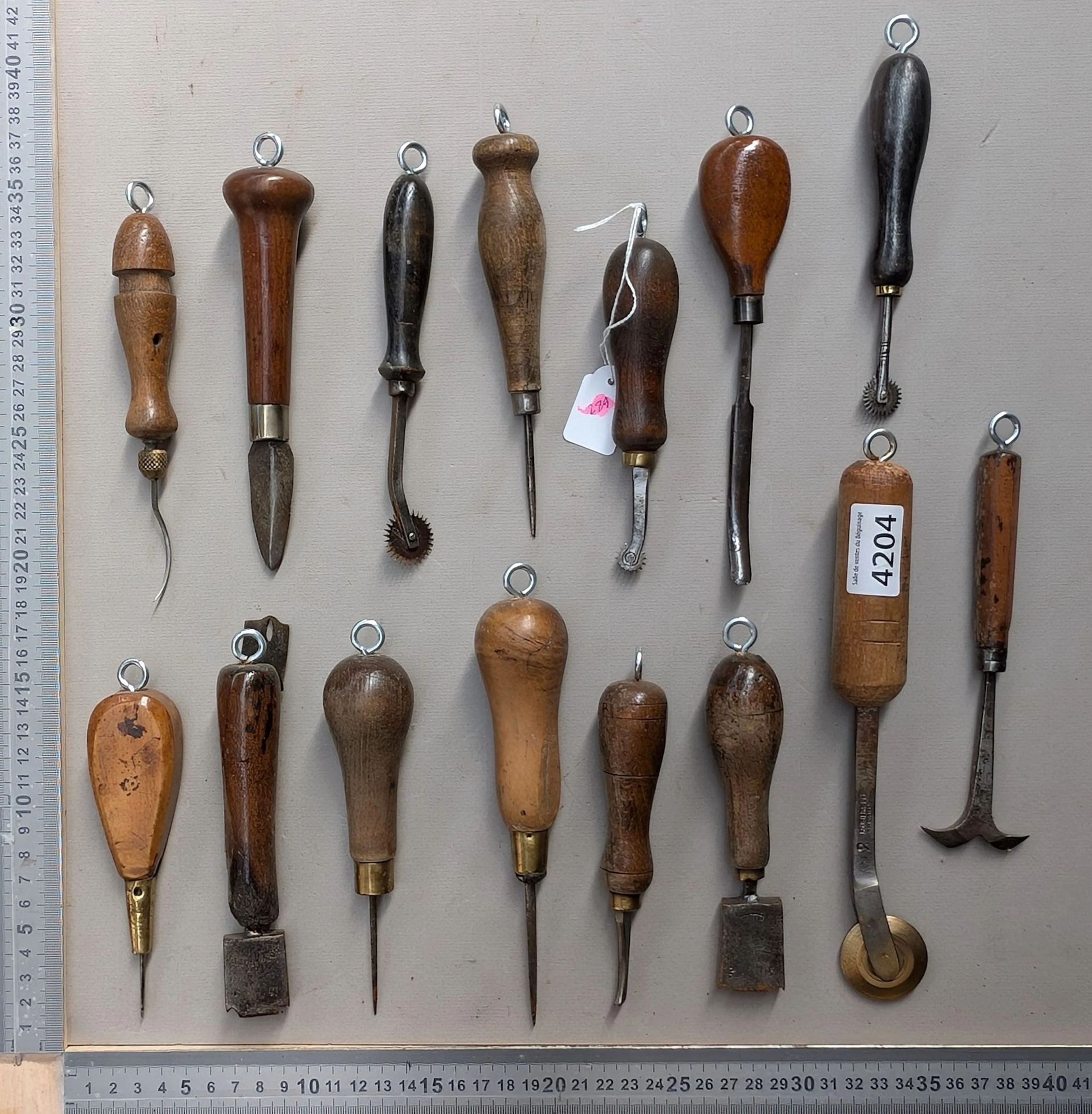15 shoemaker's and saddler's tools on an oak base—see photos for dimensions