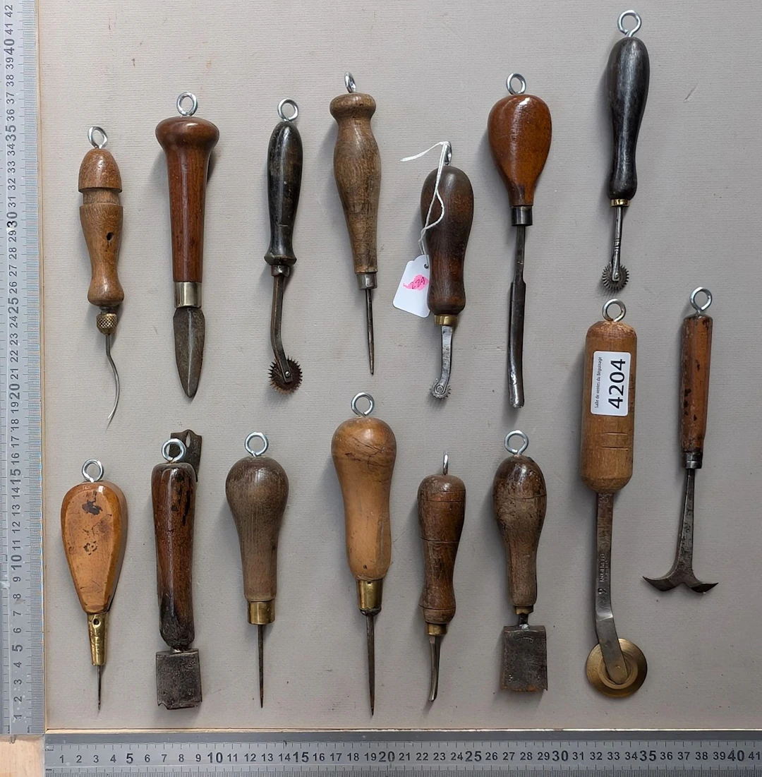 15 shoemaker's and saddler's tools on an oak base—see photos for dimensions