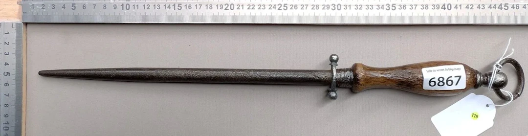 Antique butcher's sharpening knife with wooden handle, 20th century—see