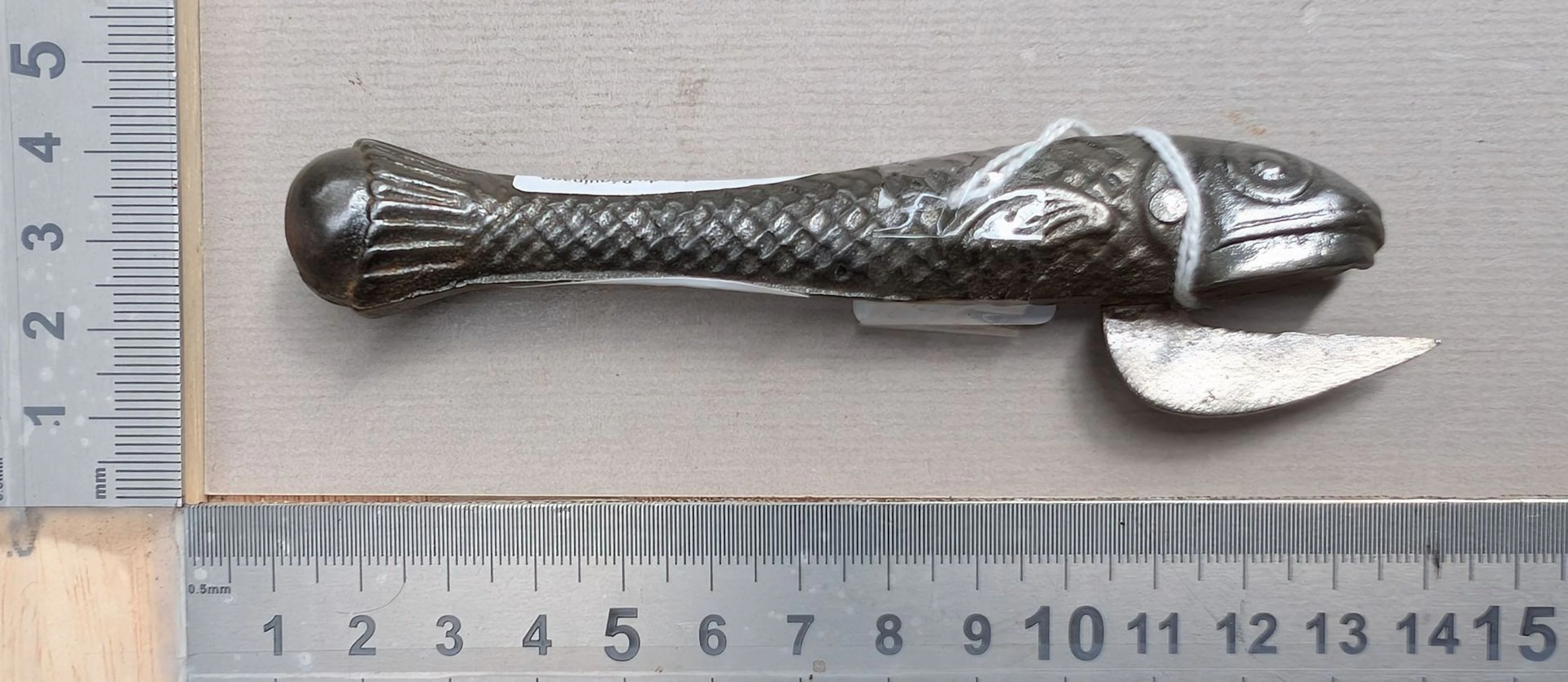 1 antique cast-iron can opener shaped like a fish—see photos for dimensions