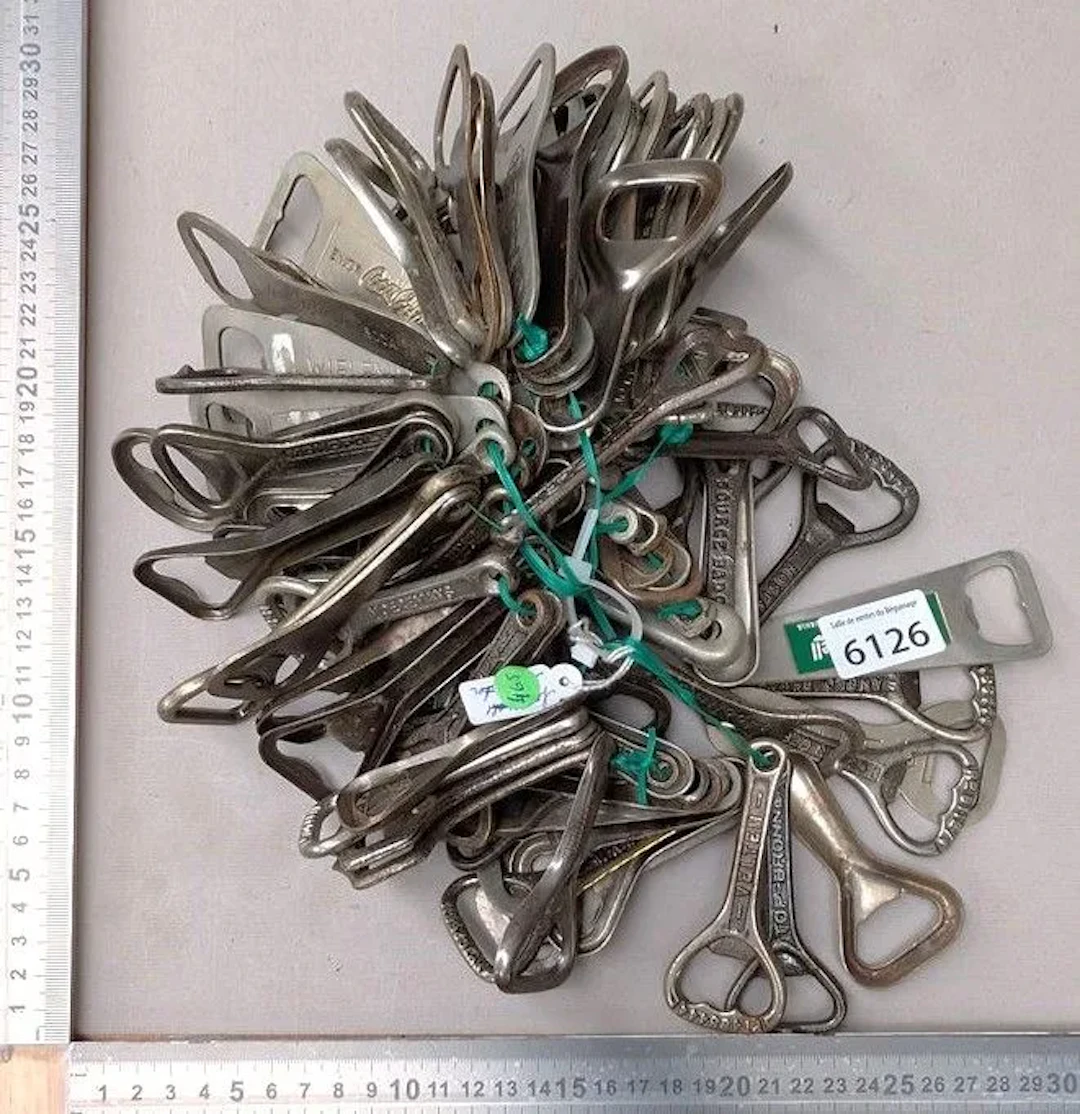 100 bottle openers—see photos for dimensions and condition