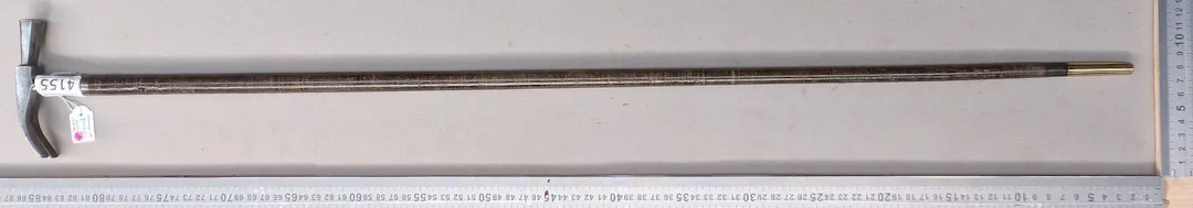 Geologist's walking stick with a leather disc handle—see photos for