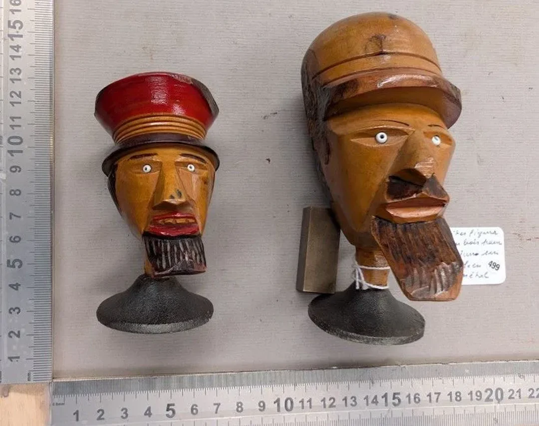 2 figurative wooden perfume bottle tops on metal bases—see photos