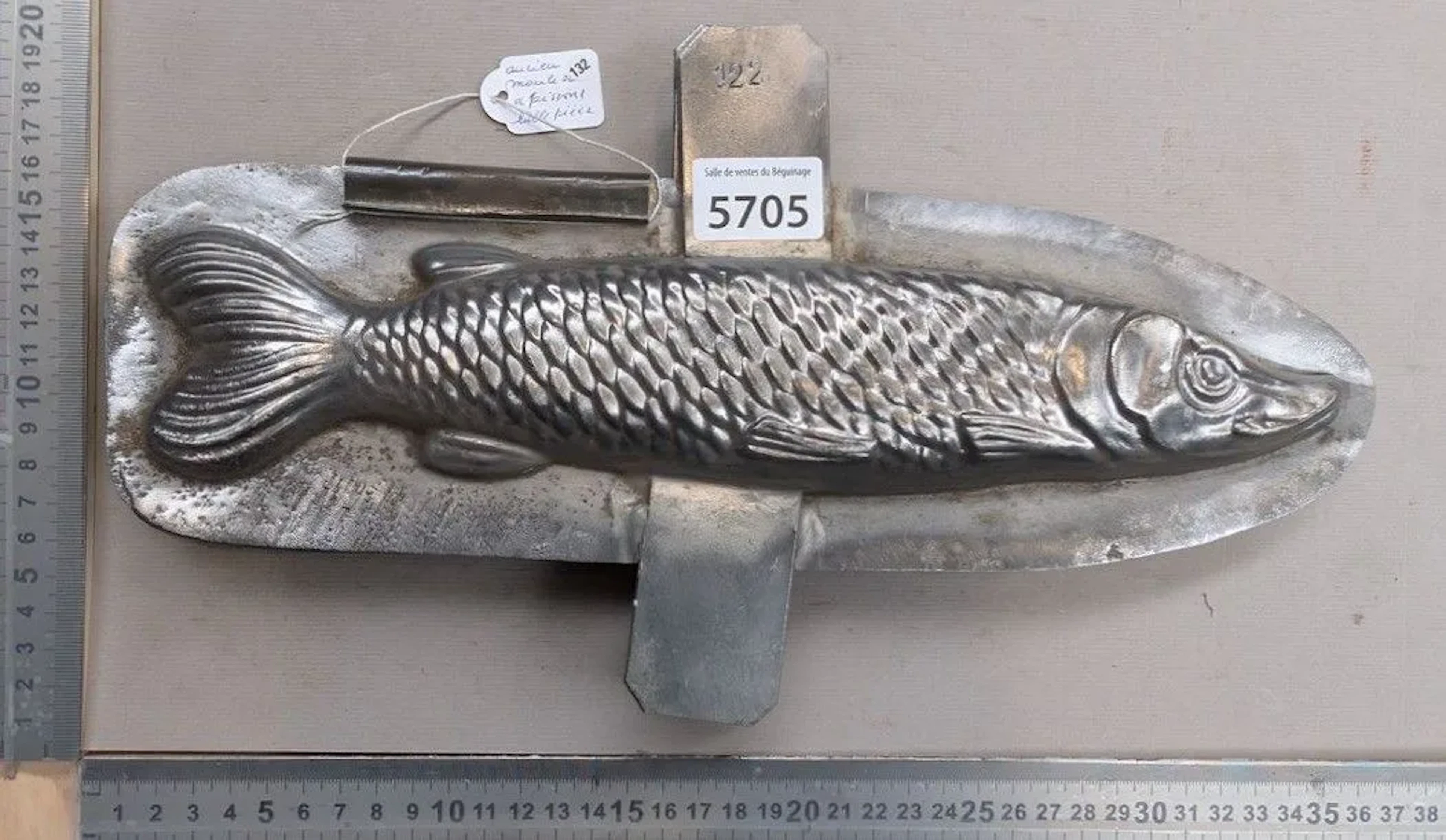 An old metal fish mold—see photos for dimensions and condition