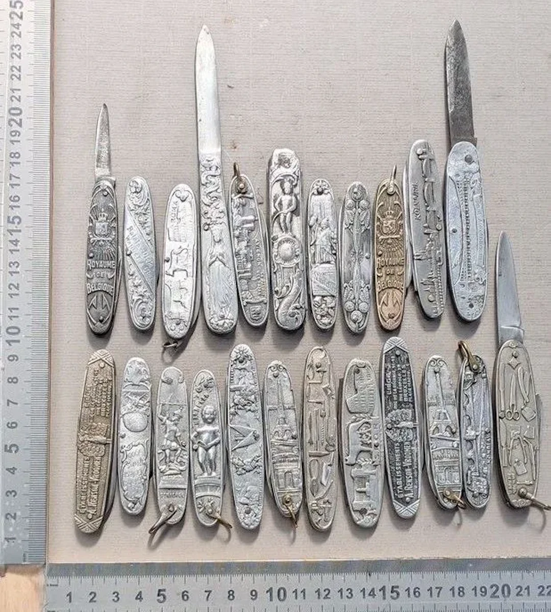 Set of 23 vintage promotional pocket knives from 1900—see photos for