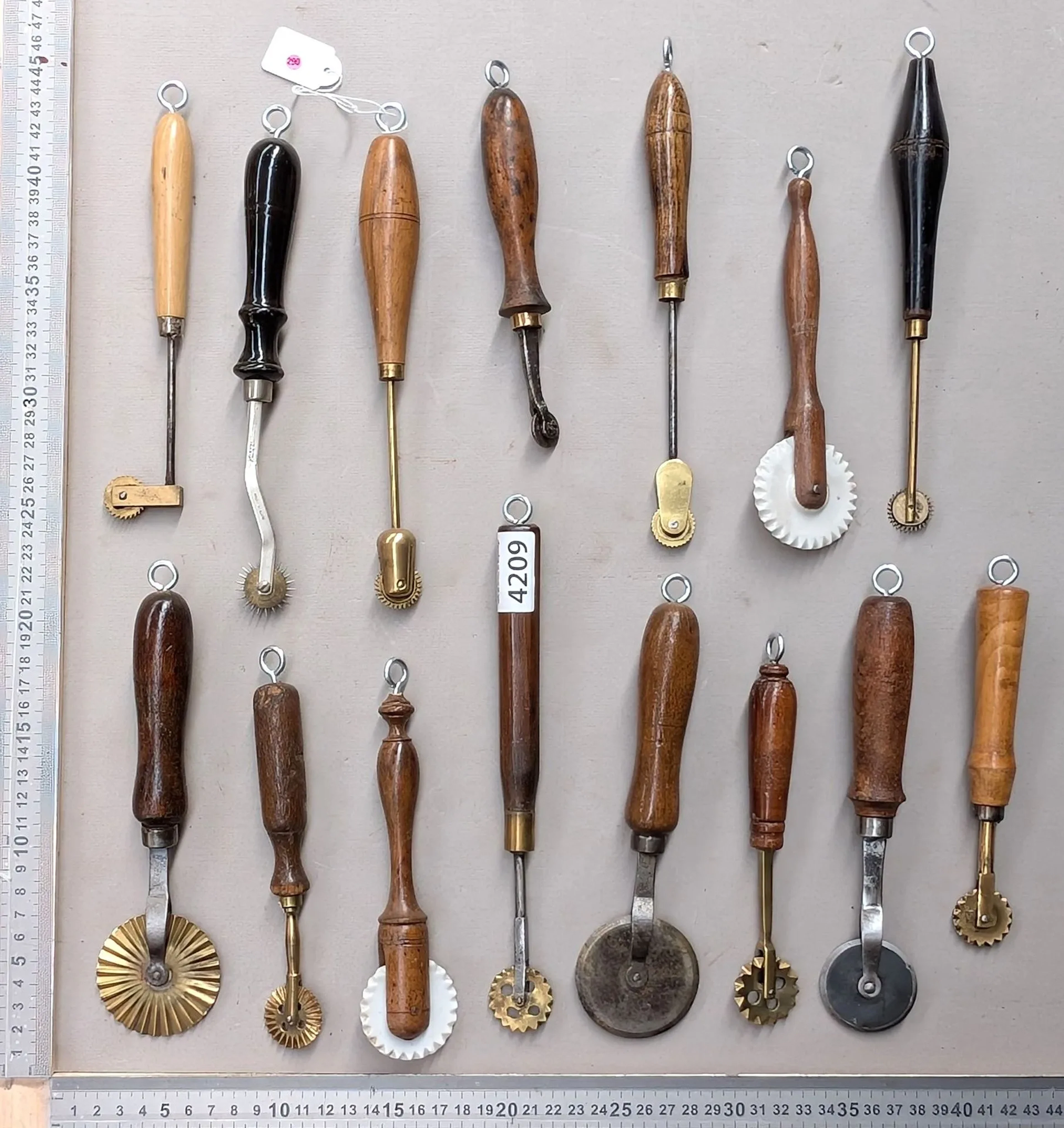 15 shoemaker's and saddler's tools on an oak base—see photos for dimensions